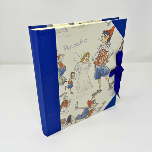Album fotografico Pinocchio con copertina illustrata e tela blu